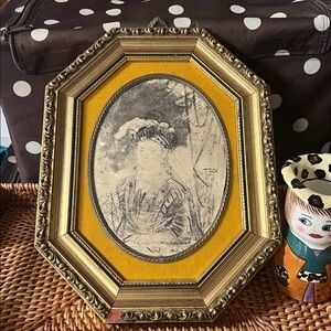 Reproduction portrait of a woman, based on Rembrandt work in vintage frame